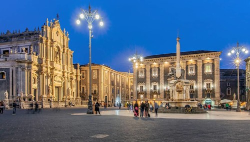 Cathedral square with cathedral and elephant fountain in the old town at dusk, Catania