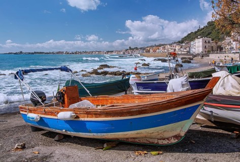 Sea surf in front of the promenade with fishing boats, Giardini-Naxos