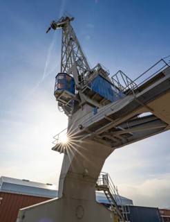 Loading crane with sun star in the port of Karlsruhe, Germany