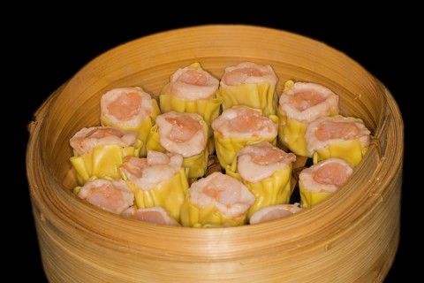 Dim Sum with fish farce and prawns, food photography with black background