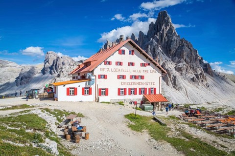 Mountain hut Dreizinnenhuette, behind rock massif Paternkofel