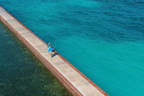 Tourists walking on a Pier surrounding Fort Jefferson, Dry Tortugas National Park