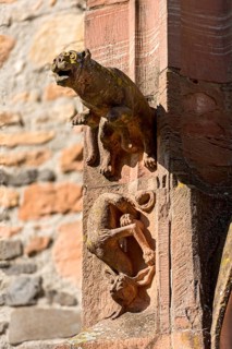 Medieval mythical creatures, gargoyles on the portal of the porch