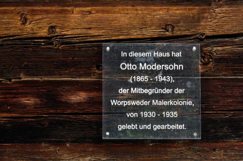 Info sign on wooden wall, Otto Modersohn the co-founder of the Worpswede painters' colony lived and worked in this house from 1930-1935