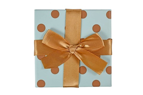 Blue gift box with golden dots and bow isolated on white background,