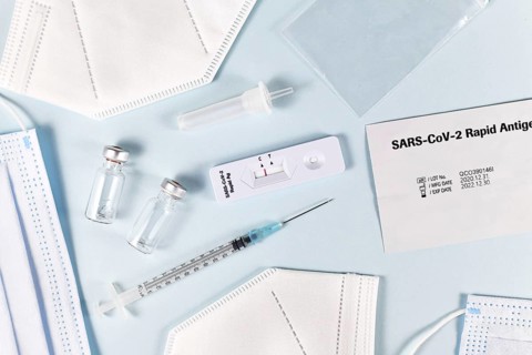 Fight Corona Virus pandemic with tools like rapid antigen test, medical face masks and vaccine vials with syringe