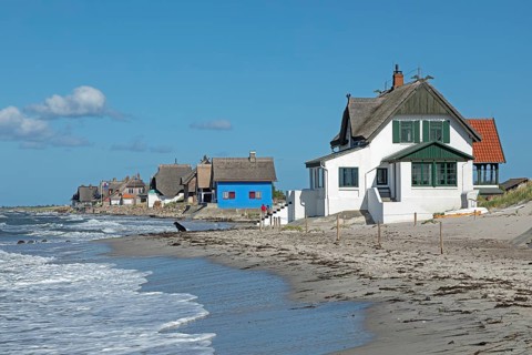 Thatched roof houses on the beach, Graswarder peninsula