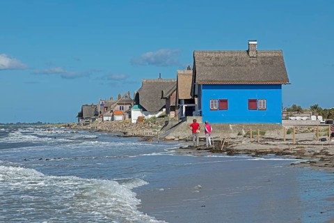 Thatched roof houses on the beach, Graswarder peninsula