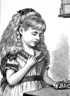 In deep distress, girl holding her little bird which she found dead in its cage