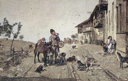 A restless impresario, street artist with donkey and dogs shows tricks in the street