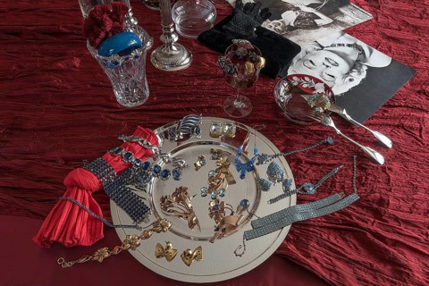 Rhinestone jewellery and accessories decorated on a silver plate and red cloth, Bavaria
