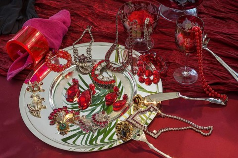 Rhinestone jewellery and accessories decorated on a silver plate and red cloth, Bavaria