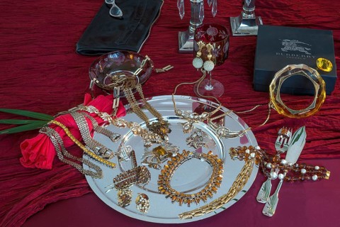 Rhinestone jewellery and accessories decorated on a silver plate and red cloth, Bavaria
