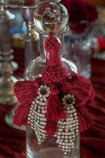 Rhinestone earrings decorated on a glass bottle, Bavaria