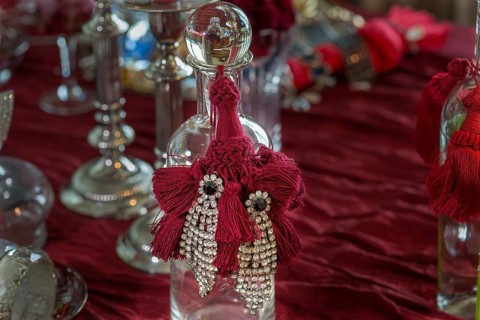 Rhinestone earrings decorated on a glass bottle, Bavaria
