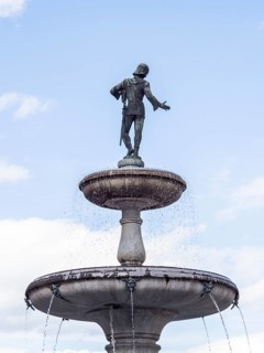 Walther von der Vogelweide Fountain on the main square of St. Veit an der Glan, St. Veit