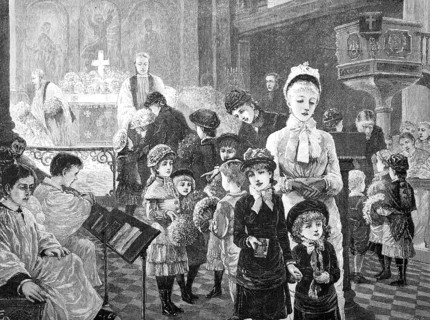 A church flower celebration in May, with children holding a bouquet of flowers