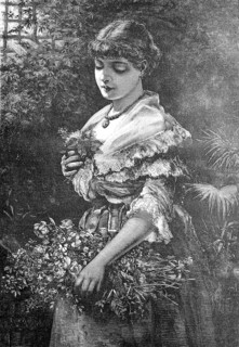 Young woman in alpine traditional costume decorated with many flowers stands in park waiting for her lover, austria