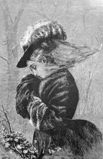 Stormy day in autumn, the veil of the elegant lady is blown away by the wind