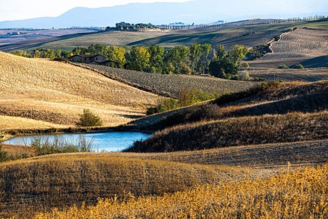 Reservoir in hilly landscape, near Siena