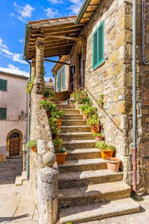 Stone staircase decorated with flower pots in the historic centre of Sorano, Sorano