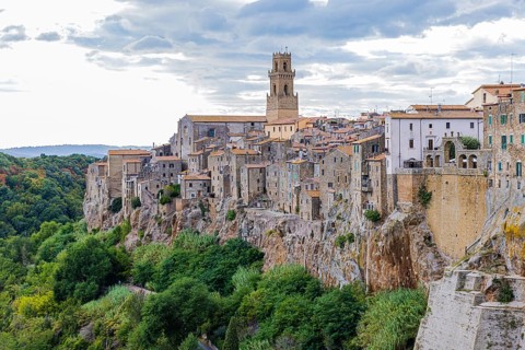 Panoramic view of the medieval town of Pitigliano, dark clouds above