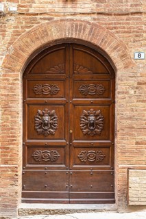 Ornate round arch front door, Montalcino