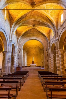 The illuminated ceiling vault of Sovana Cathedral, view to the altar