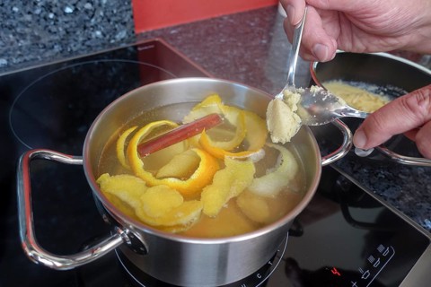 Swabian cuisine, preparation of sweet semolina dumplings in hot water with oranges and lemon zest