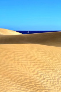 The dunes of Playa Del Ingles with a view of the Atlantic Ocean. San Bartolome de Tirajana, Gran Canaria