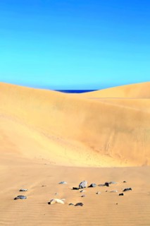 The dunes of Playa Del Ingles with a view of the Atlantic Ocean. San Bartolome de Tirajana, Gran Canaria