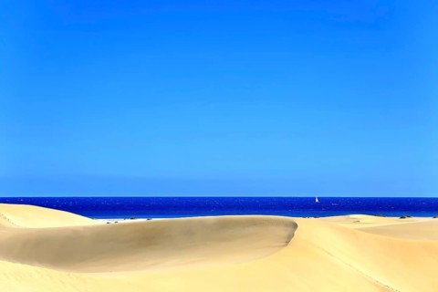 The dunes of Playa Del Ingles with a view of the Atlantic Ocean. San Bartolome de Tirajana, Gran Canaria