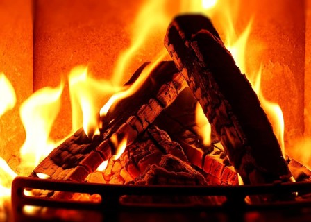 Cosy stove fire with burning logs,