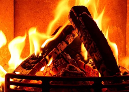 Cosy stove fire with burning logs,