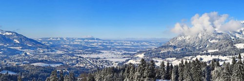Wonderful winter landscape under a blue sky with a view of the Alpine foothills. Sonthofen, Oberallgaeu