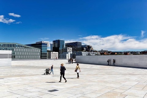Pedestrians on the white roof of the opera house, modern architecture