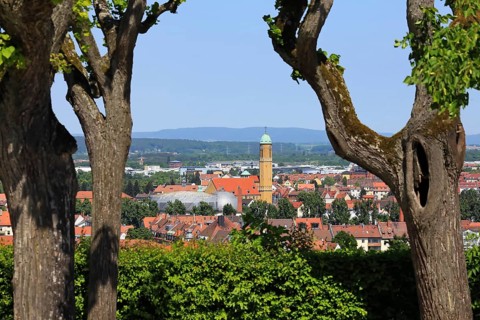 View between the trees of St. Otto in Bamberg in bright sunshine. Bamberg, Upper Franconia
