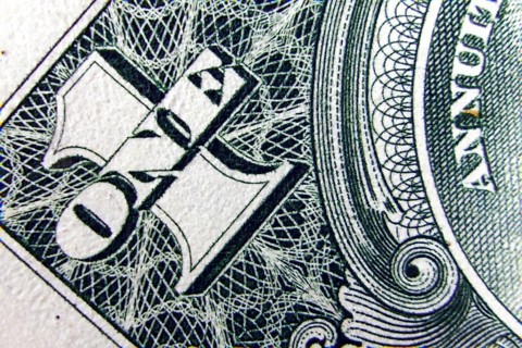 Macro of one dollar note greatly enlarged,