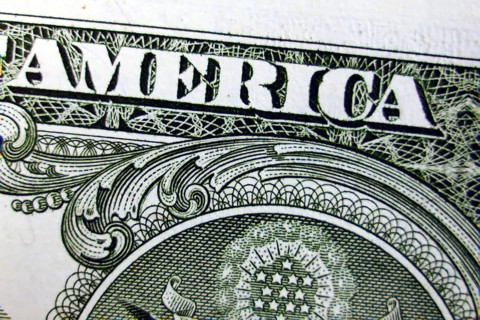 Macro of one dollar note greatly enlarged,