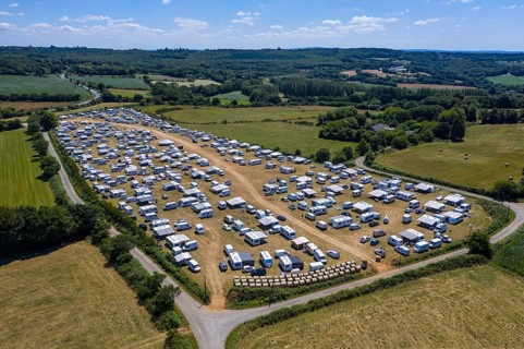 Aerial view of Gens de Voyage or Travelling People camp set up without permission in a field in Dirinon, Finistere Penn-ar-Bed department
