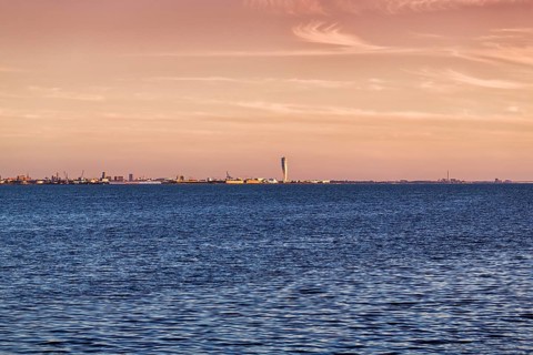 View over the Oeresund to the skyline of Malmoe, Turning Torso skyscraper on the horizon
