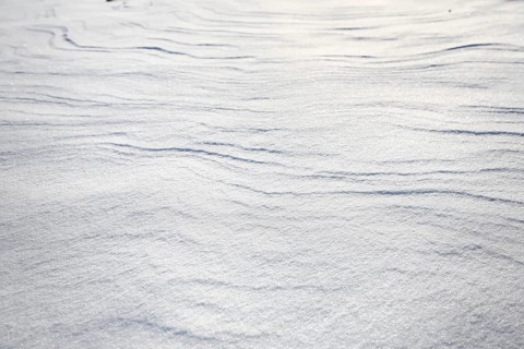 Snow drifts caused by wind from powder snow look like dunes and form bizarre patterns and structures,