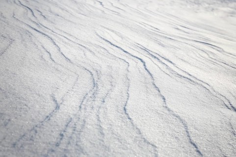 Snow drifts caused by wind from powder snow look like dunes and form bizarre patterns and structures,