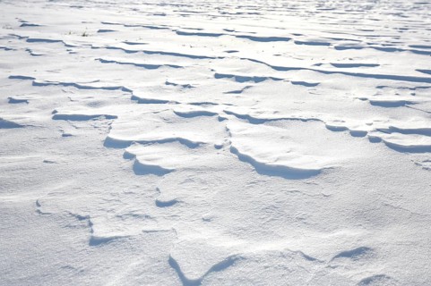 Snow drifts caused by wind from powder snow look like dunes and form bizarre patterns and structures,