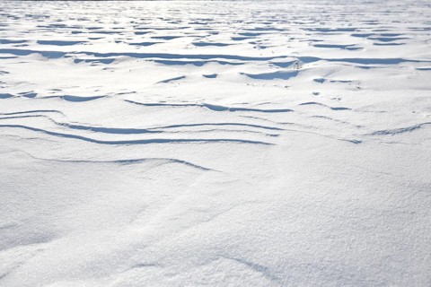 Snow drifts caused by wind from powder snow look like dunes and form bizarre patterns and structures,