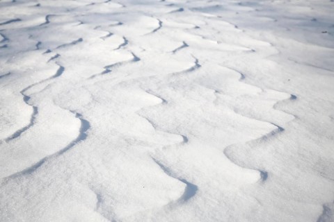Snow drifts caused by wind from powder snow look like dunes and form bizarre patterns and structures,