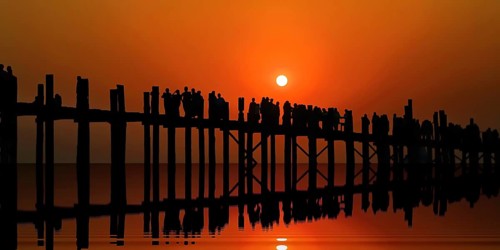 Teak U-leg bridge at sunset. Amarapura, Taungthaman Lake