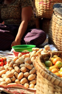 Vegetable vendor at Mani Sithu Market. Nyaung-U, Myanmar
