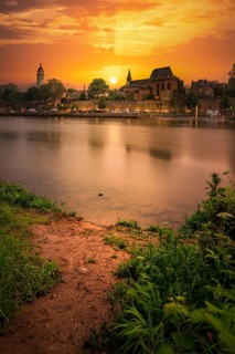 Long exposure, view over the river Main to the skyline of Hoechst in the sunset