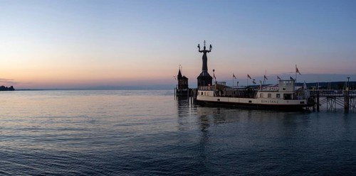 Morning light in the harbour of Constance with Imperia and and the historic ferry Constance, Constance